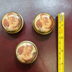 3 tiny cans with angel pictures
